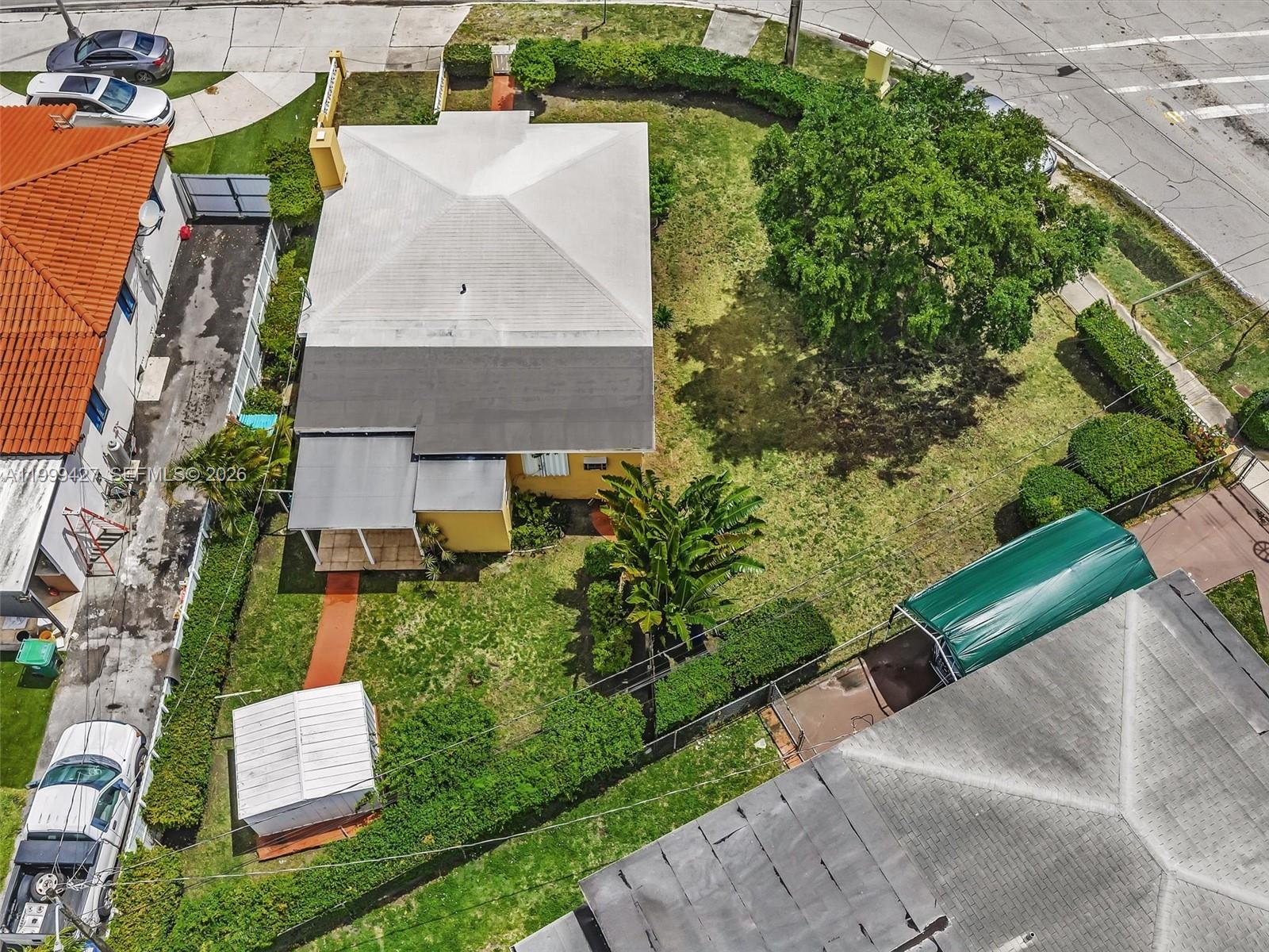 10 Southwest 72nd Avenue Miami, FL 33144 - Photo 2 of 35 an aerial view of a house with a yard and trees