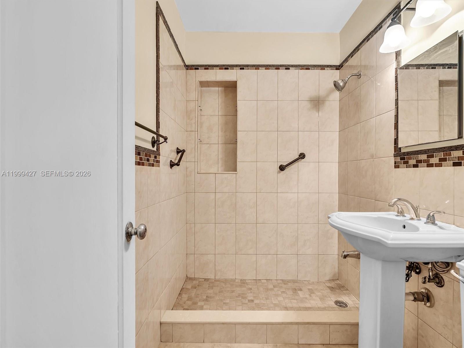 10 Southwest 72nd Avenue Miami, FL 33144 - Photo 22 of 35 a bathroom with a shower and a sink