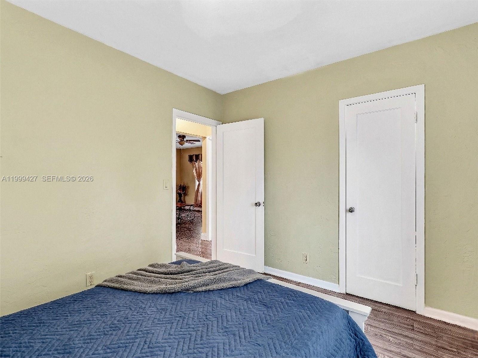 10 Southwest 72nd Avenue Miami, FL 33144 - Photo 25 of 35 a view of an empty room with wooden floor and shoes