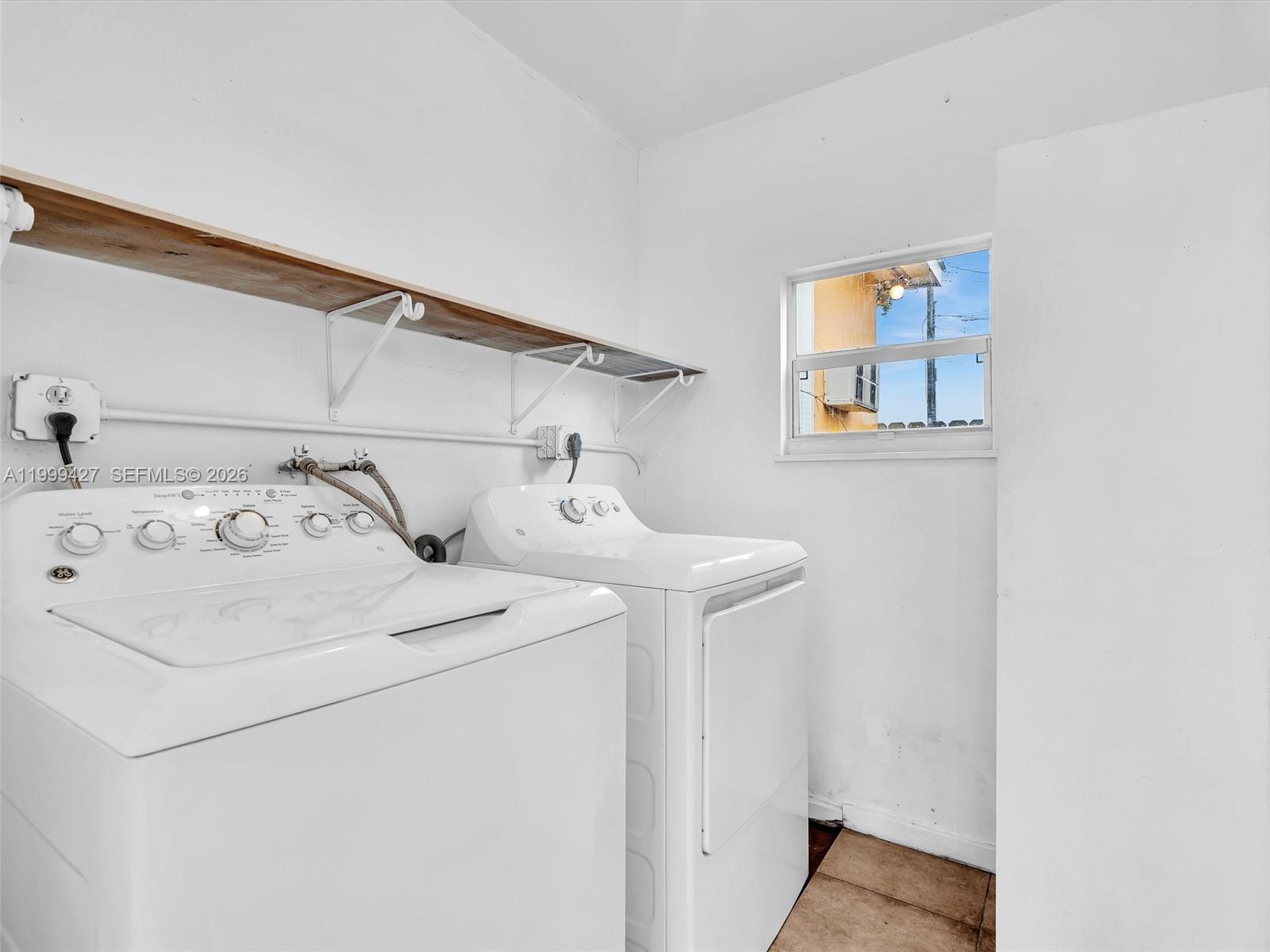 10 Southwest 72nd Avenue Miami, FL 33144 - Photo 27 of 35 a utility room with dryer and washer
