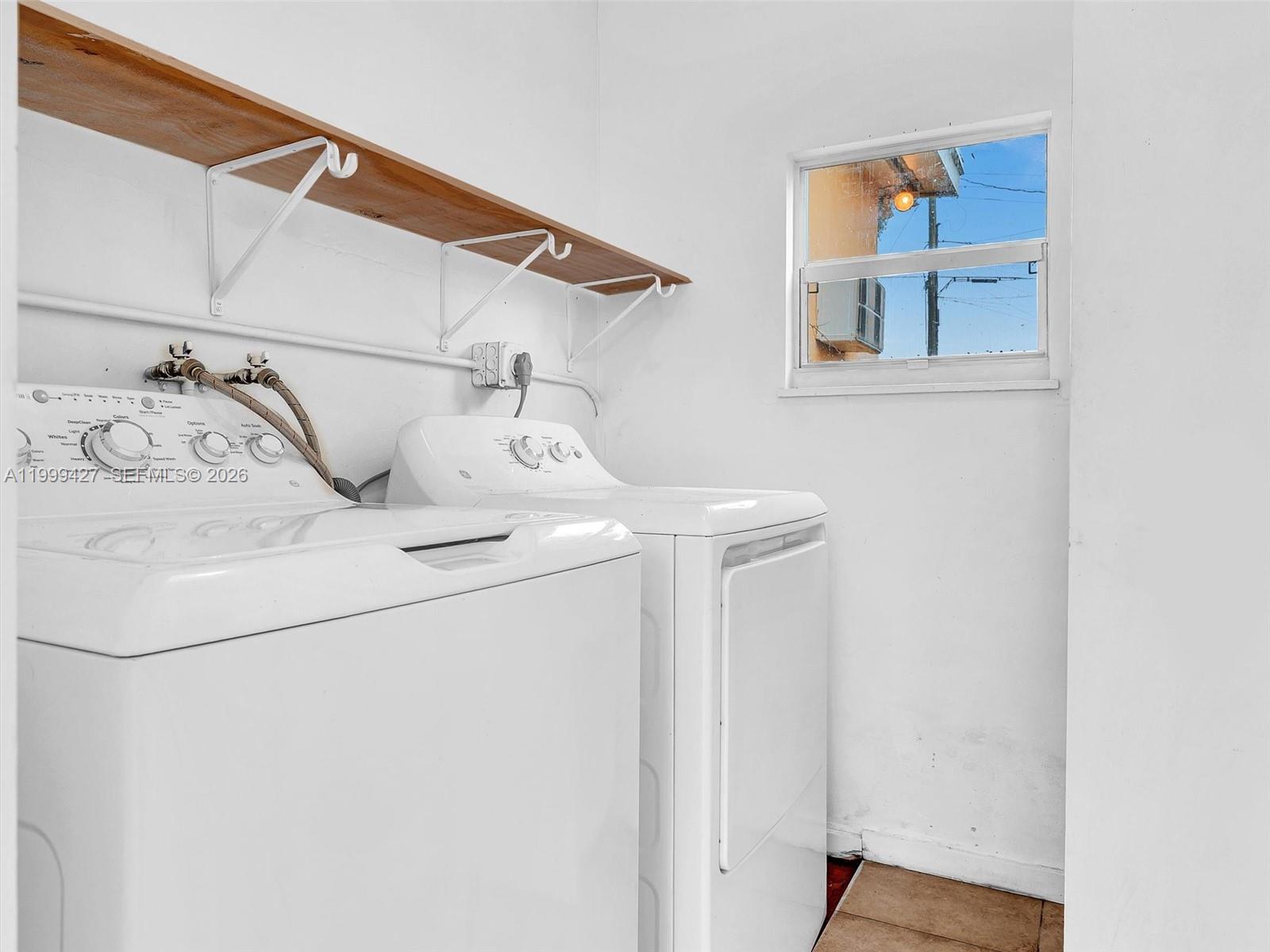 10 Southwest 72nd Avenue Miami, FL 33144 - Photo 28 of 35 a utility room with dryer and washer