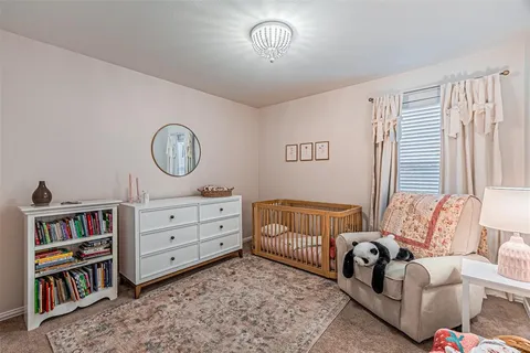 a bedroom with furniture and a book shelf