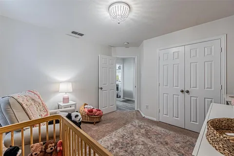 a bedroom with furniture and a window