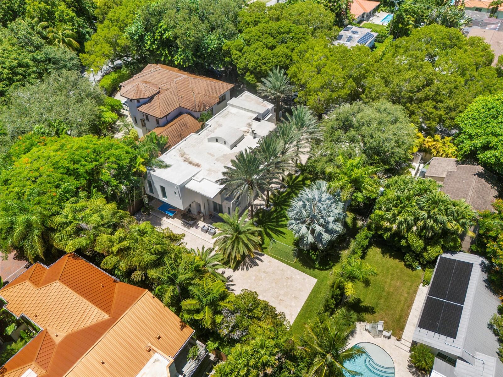 3917 South Le Jeune Road Miami, FL 33146 - Photo 16 of 91 an aerial view of a house with a yard and outdoor seating
