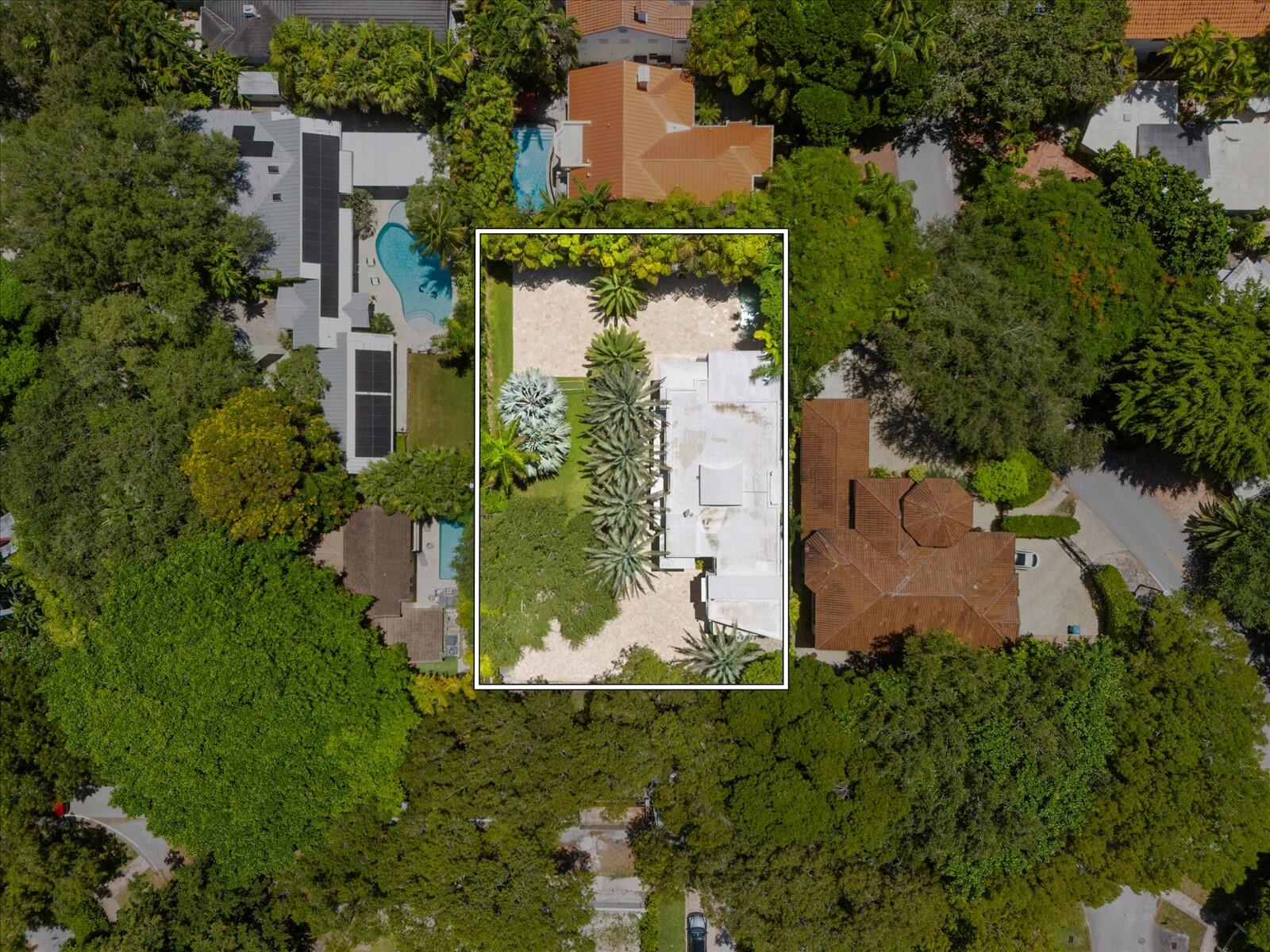 3917 South Le Jeune Road Miami, FL 33146 - Photo 26 of 91 an aerial view of a residential houses with outdoor space and trees all around