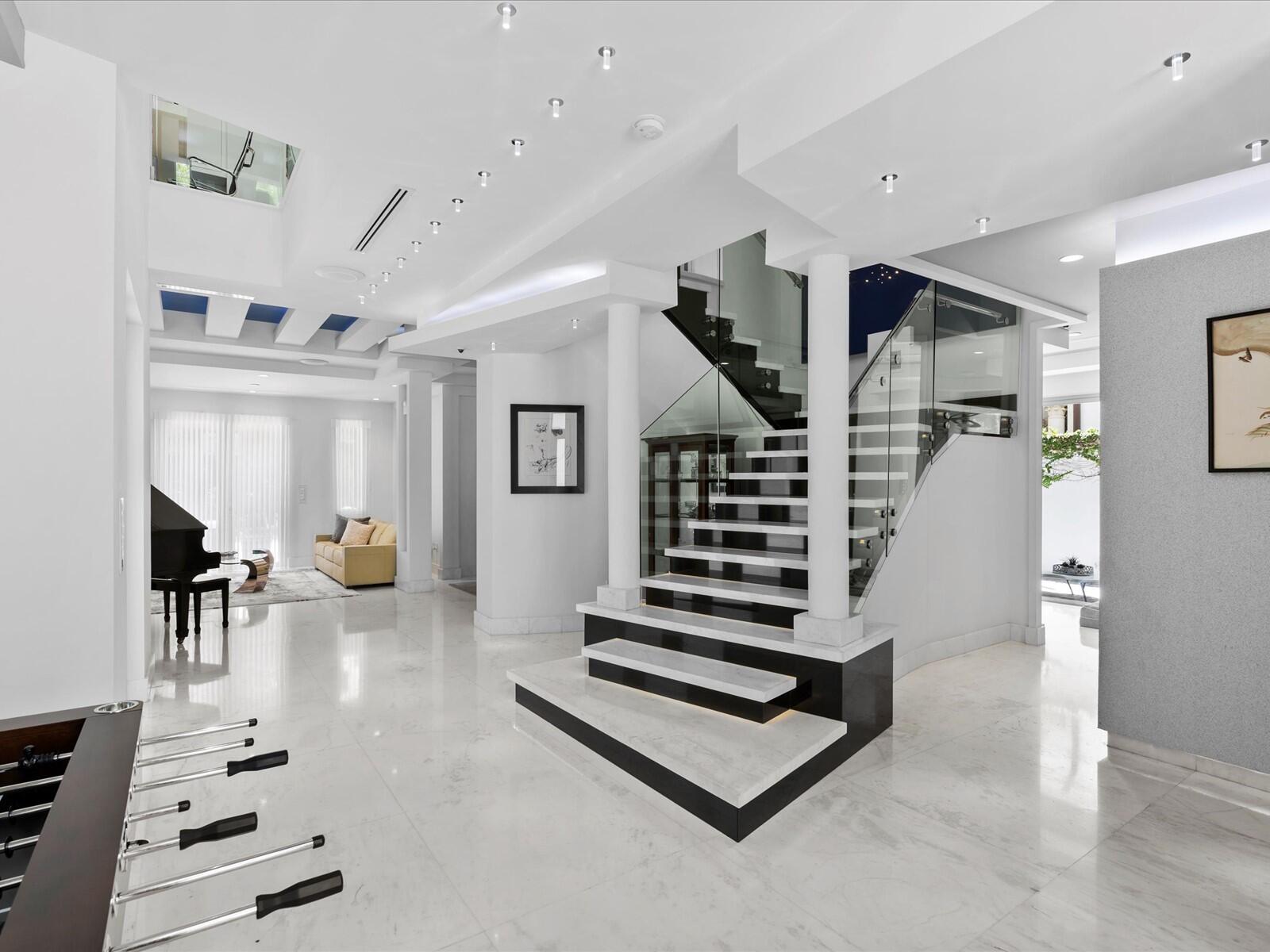 3917 South Le Jeune Road Miami, FL 33146 - Photo 38 of 91 a living room with furniture and a chandelier