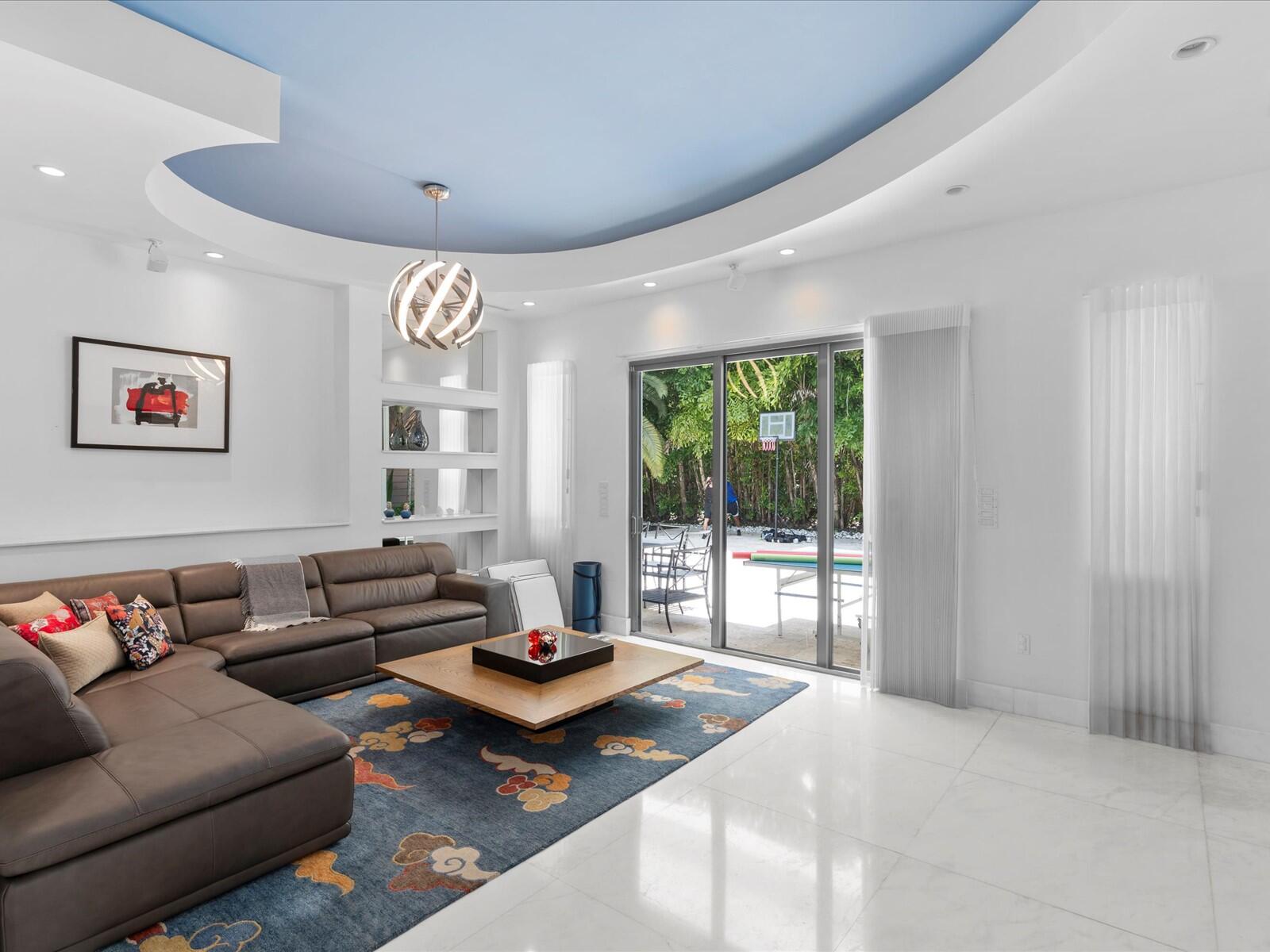 3917 South Le Jeune Road Miami, FL 33146 - Photo 49 of 91 a living room with furniture and a large window