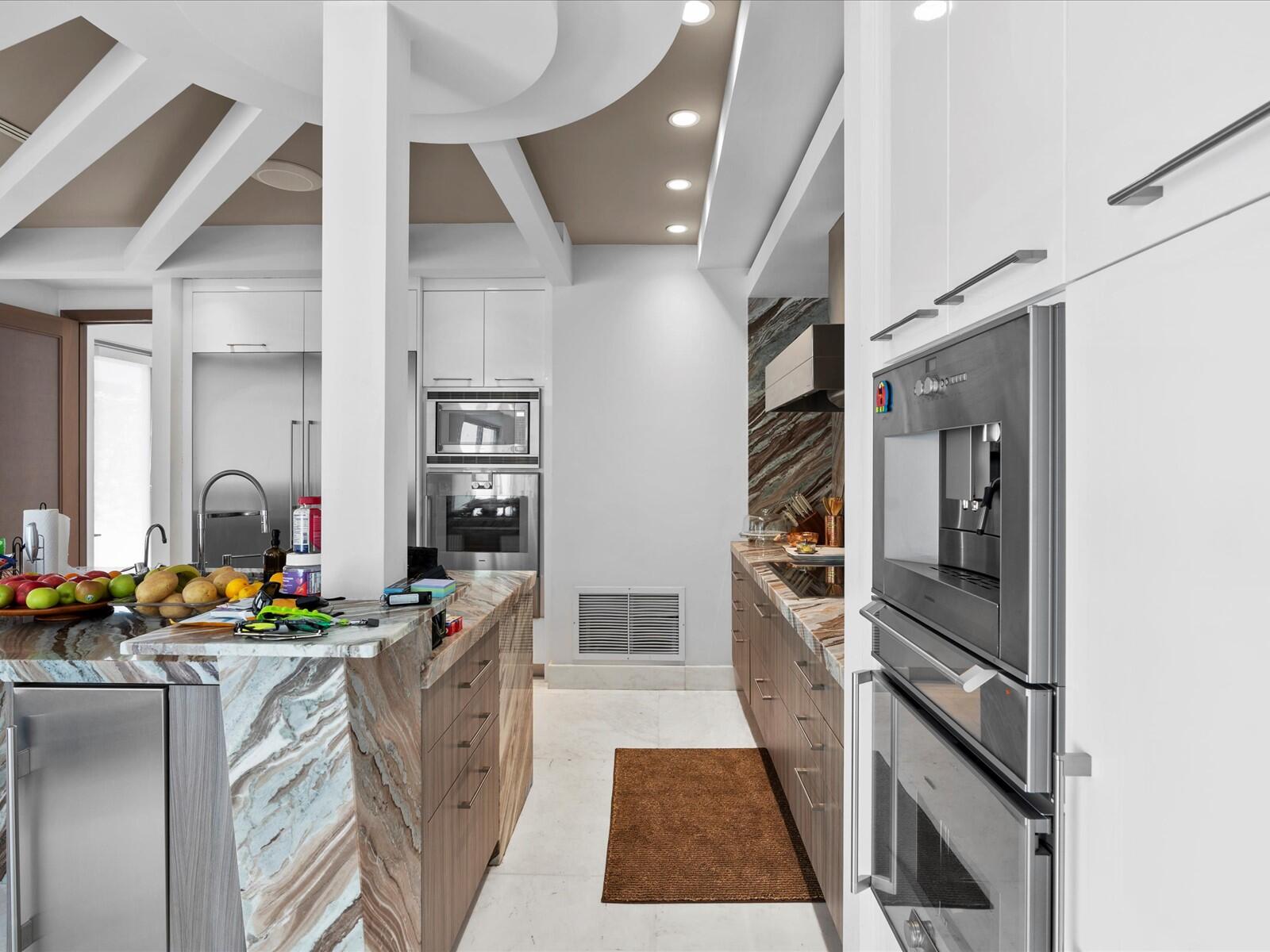 3917 South Le Jeune Road Miami, FL 33146 - Photo 54 of 91 a kitchen with stainless steel appliances a refrigerator and a stove