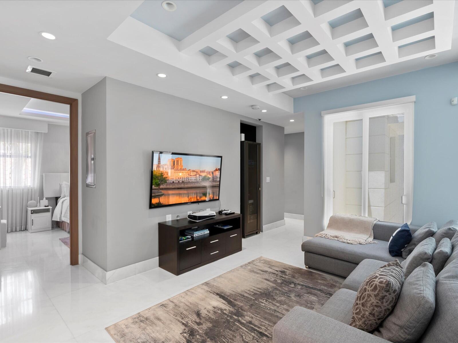 3917 South Le Jeune Road Miami, FL 33146 - Photo 68 of 91 a living room with furniture and a flat screen tv