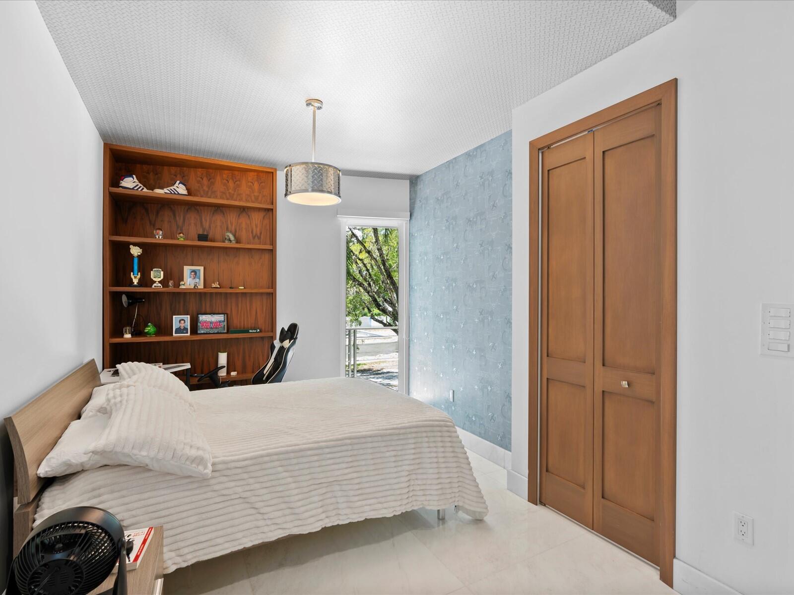 3917 South Le Jeune Road Miami, FL 33146 - Photo 86 of 91 a bedroom with a bed and a window