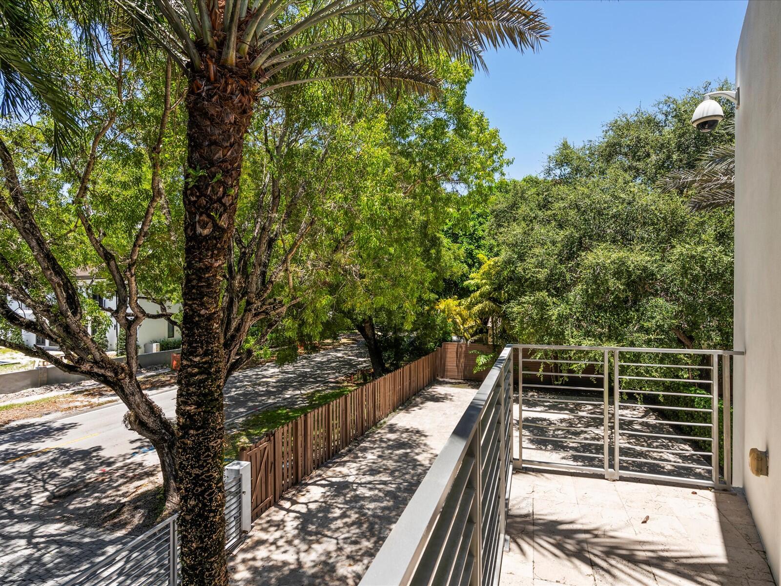 3917 South Le Jeune Road Miami, FL 33146 - Photo 90 of 91 a view of balcony with wooden floor and fence