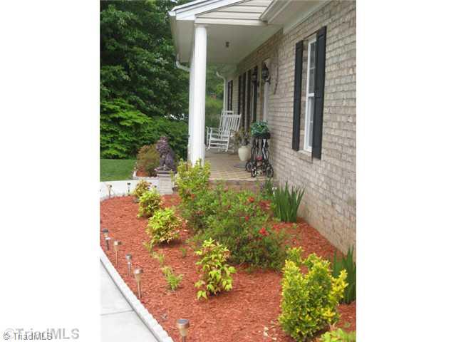 3500 Edgefield Road Greensboro, NC 27409 - Photo 2 of 16 Exterior Front. Beautiful landscaping with tiled front porch!!