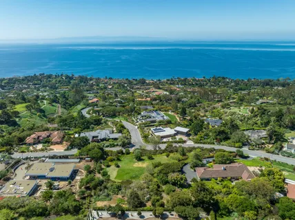 an aerial view of beach and ocean