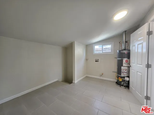 a view of a room with a white wall