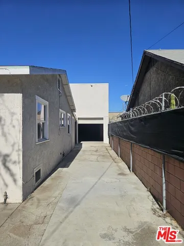 a view of an empty room and wooden floor