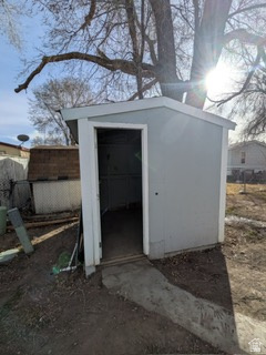 8155 South Redwood Road, Unit 96 West Jordan, UT 84088 - Photo 17 of 17 Garage with a storage shed