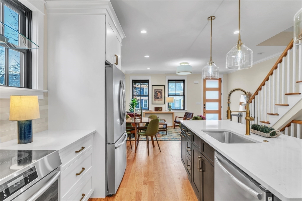 37 Landy Avenue Northampton, MA 01062 - Photo 14 of 41 a large kitchen with lots of counter space a sink appliances and a dining table