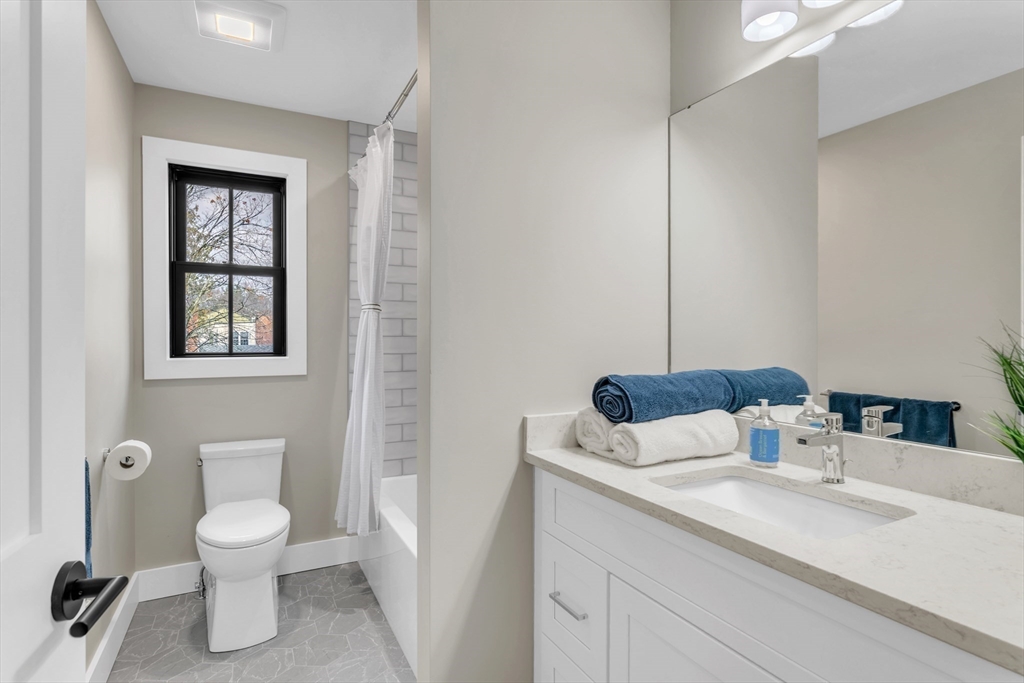 37 Landy Avenue Northampton, MA 01062 - Photo 26 of 41 a bathroom with a toilet a sink and mirror