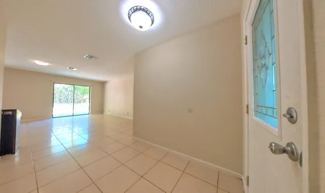 a view of an empty room and window