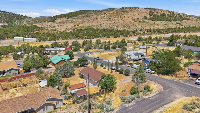 132 Rex Layne Drive Central, UT 84722 - Photo 33 of 39 Residential neighborhood featuring a paved street and surrounding natural landscape