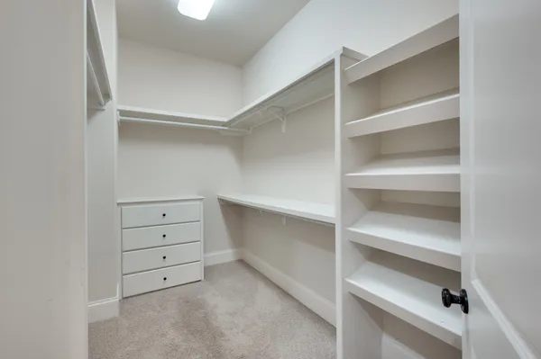 a view of an empty walk in closet