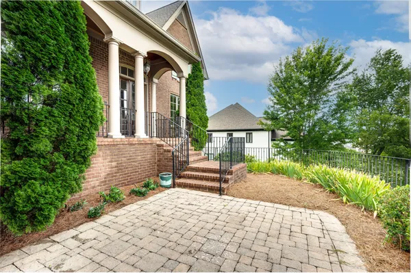 a front view of a house with garden