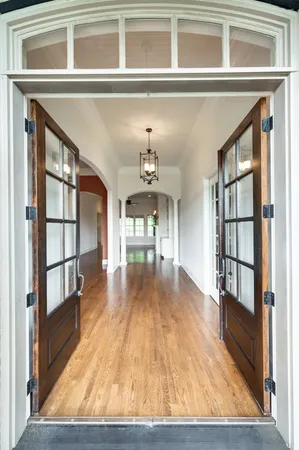 a view of livingroom with furniture staircase and windows