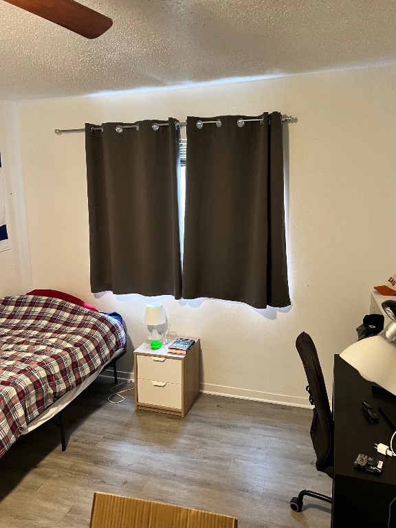 2510 San Gabriel Street, Unit 301 Austin, TX 78705 - Photo 19 of 22 a bedroom with a bed and a desk