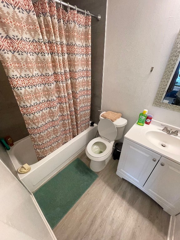 2510 San Gabriel Street, Unit 301 Austin, TX 78705 - Photo 8 of 22 a bathroom with a sink mirror vanity and toilet