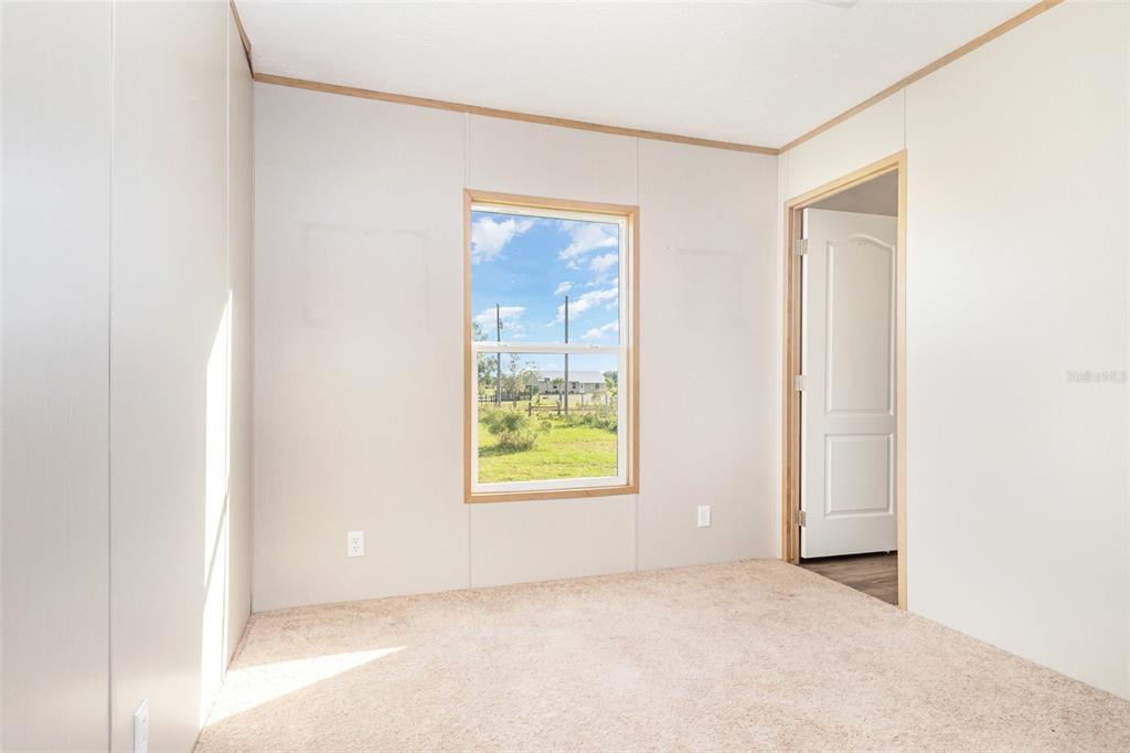 16423 Northwest 262nd Street Okeechobee, FL 34972 - Photo 19 of 30 an empty room with windows