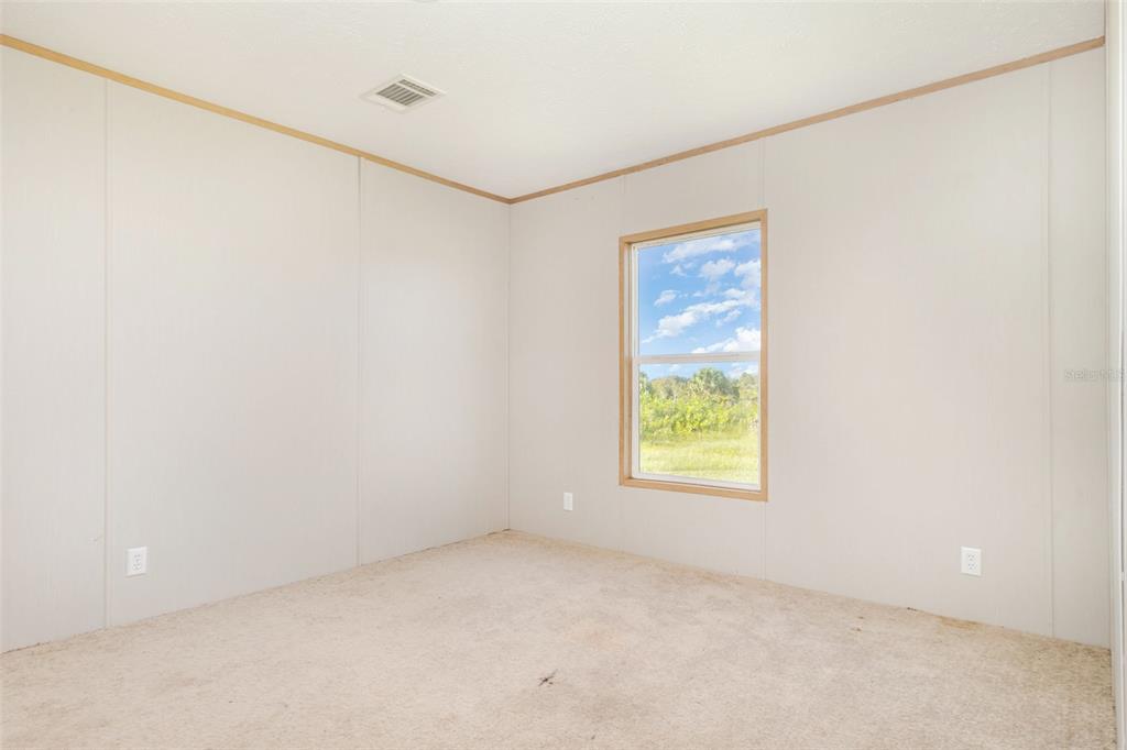 16423 Northwest 262nd Street Okeechobee, FL 34972 - Photo 22 of 30 an empty room with windows