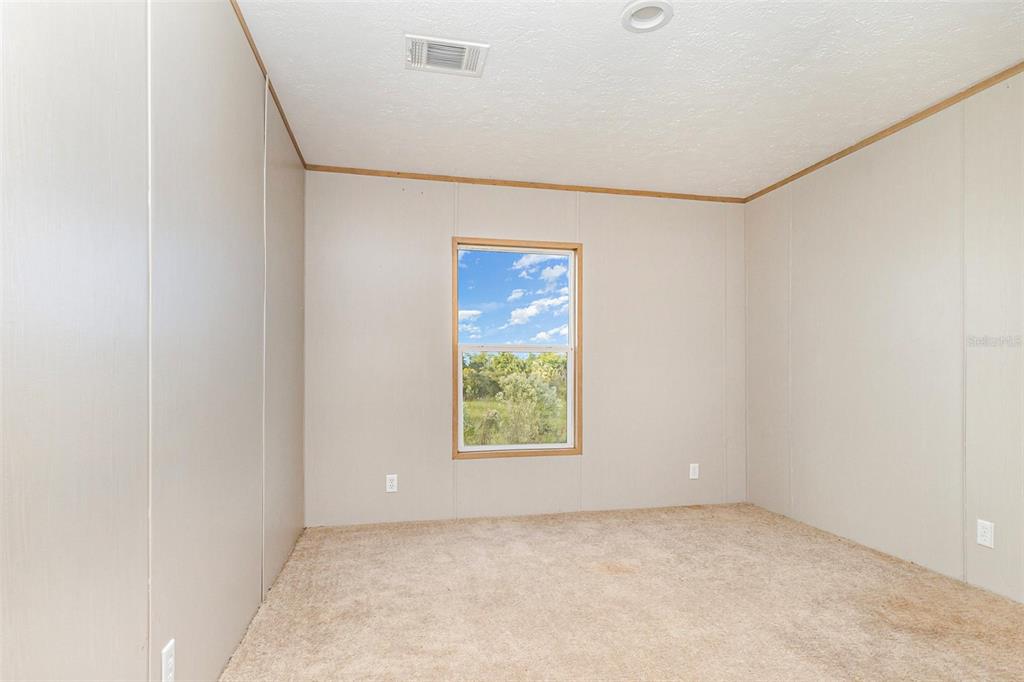 16423 Northwest 262nd Street Okeechobee, FL 34972 - Photo 24 of 30 a view of an empty room with a window