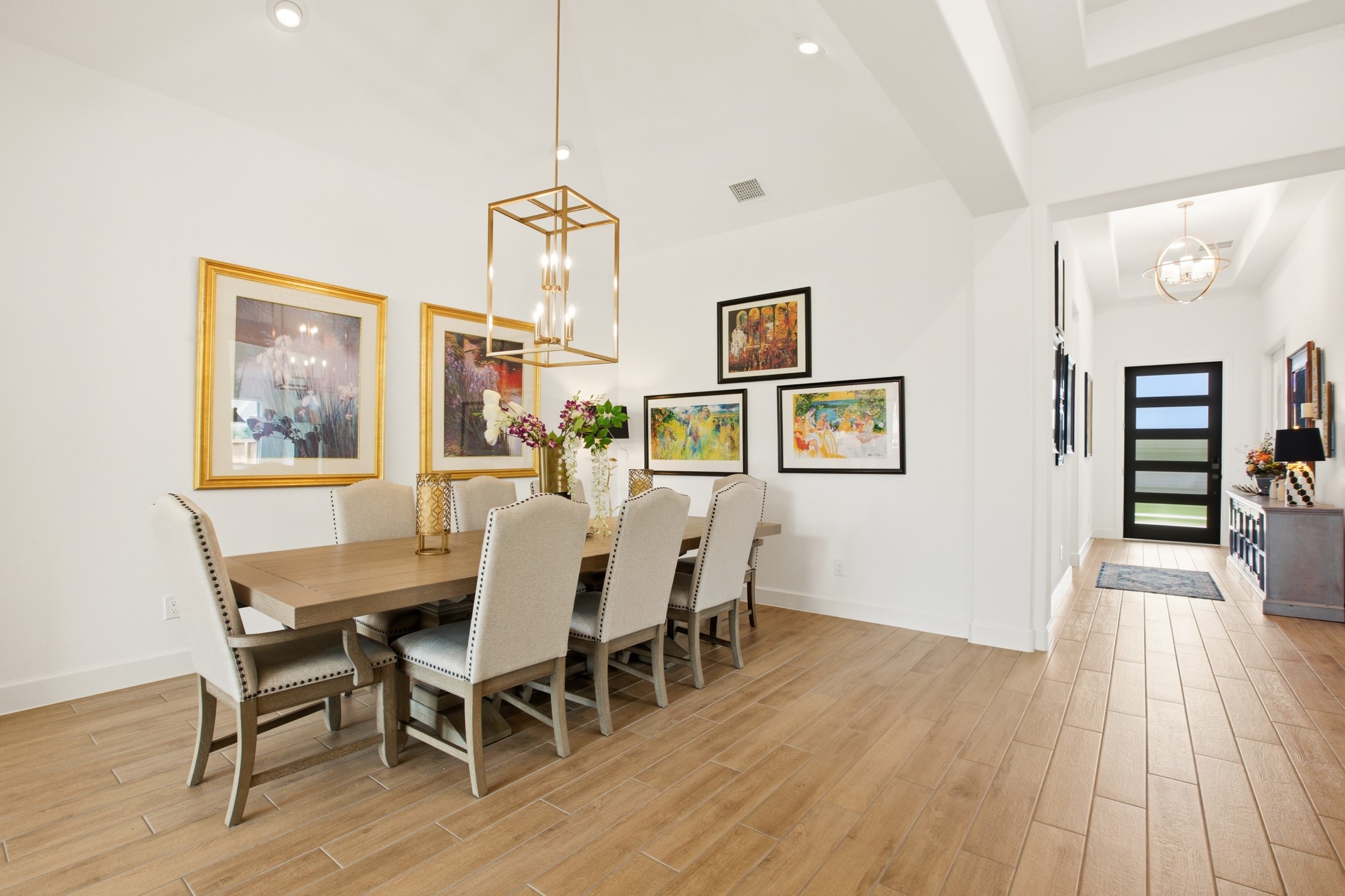 5422 Farm Hill Way Fulshear, TX 77406 - Photo 12 of 50 a view of a dining room with furniture wooden floor and chandelier