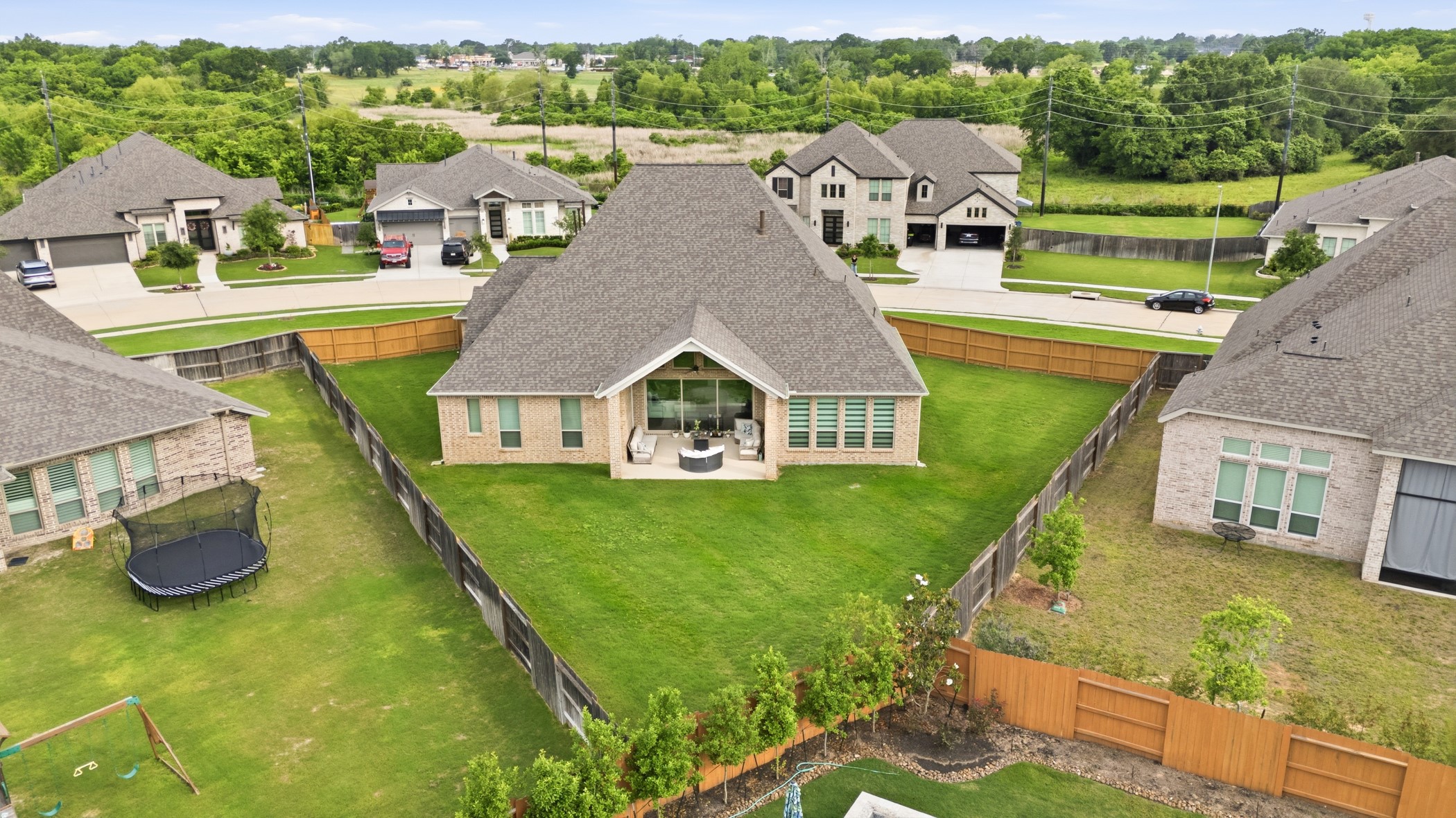 5422 Farm Hill Way Fulshear, TX 77406 - Photo 3 of 50 an aerial view of a house with swimming pool and a yard