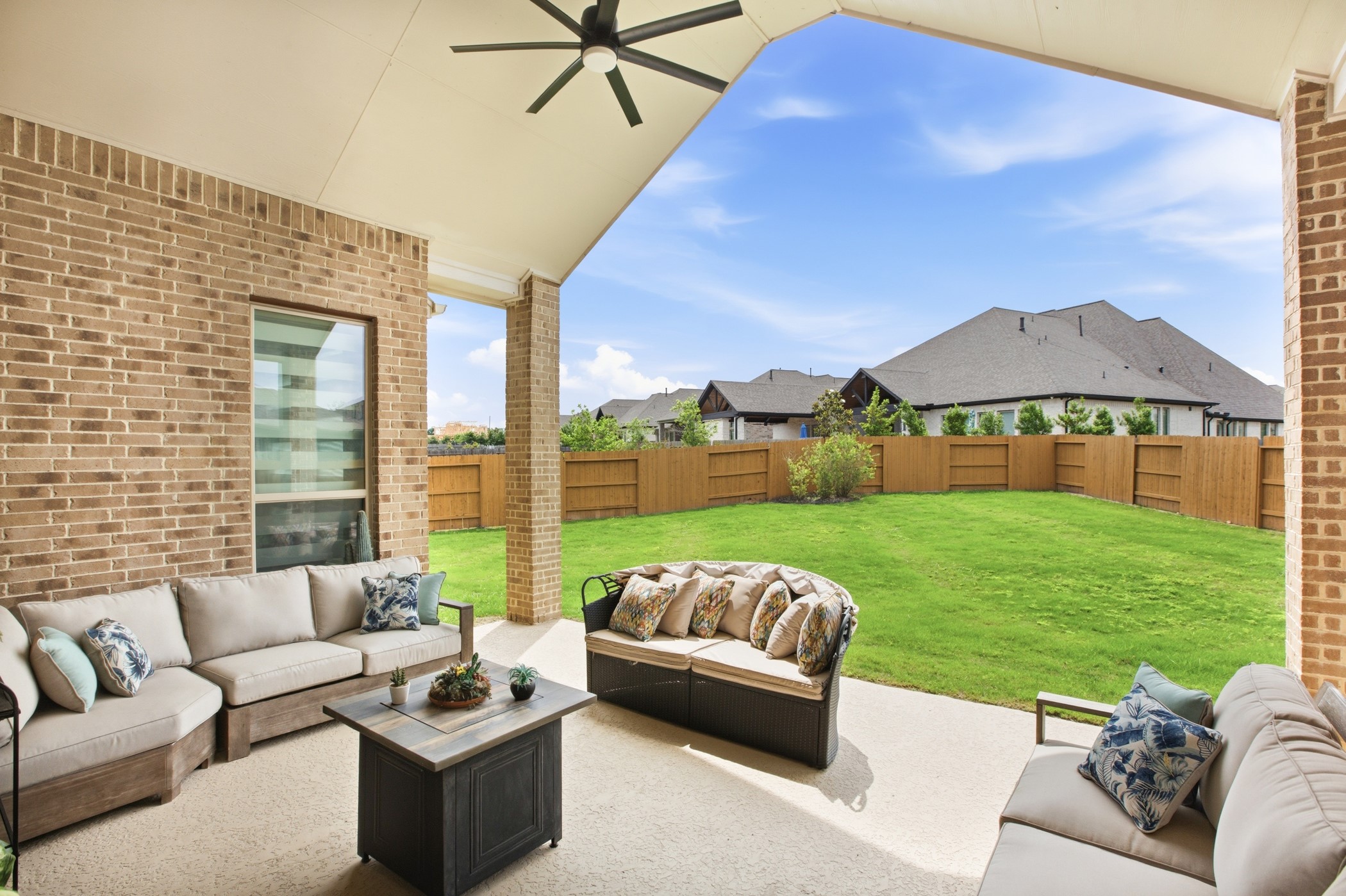 5422 Farm Hill Way Fulshear, TX 77406 - Photo 39 of 50 a view of a patio with couches chairs and a yard