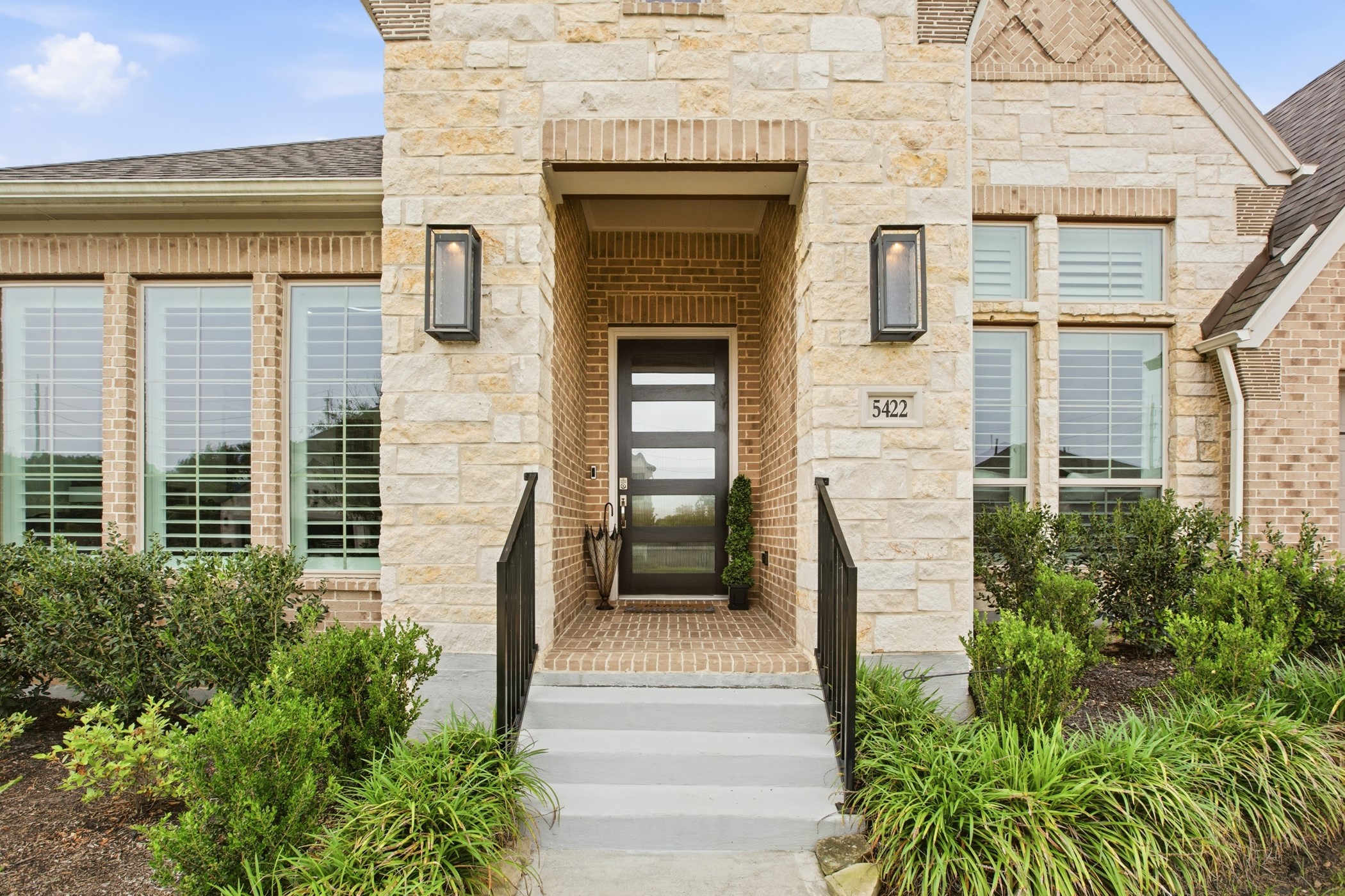 5422 Farm Hill Way Fulshear, TX 77406 - Photo 5 of 50 a front view of a house with a garden