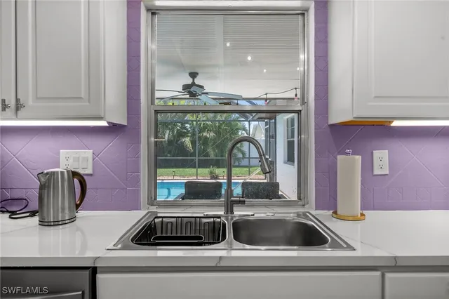 a kitchen sink with a window