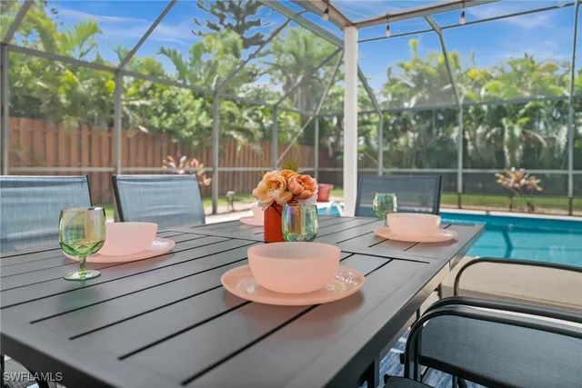a view of a table and chairs in the patio