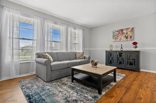 a living room with furniture and a window