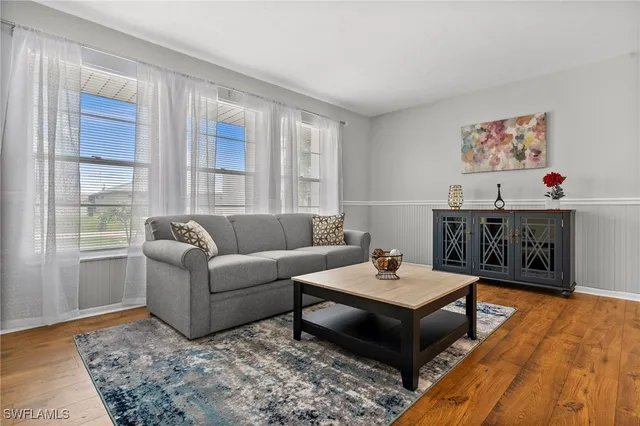 a living room with furniture and a window