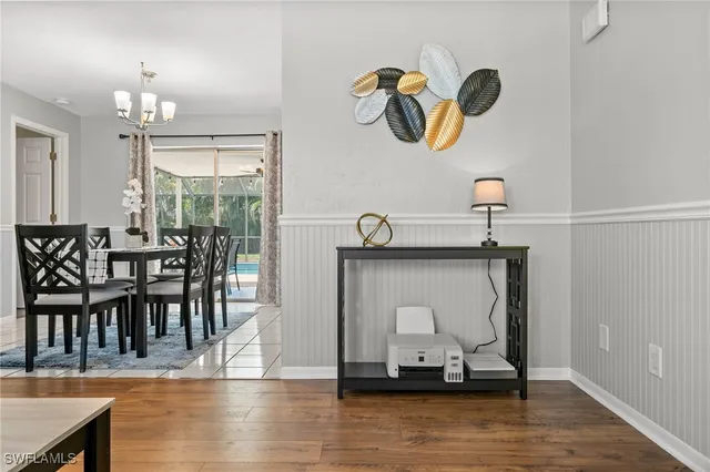 a view of dining room and kitchen with wooden floor