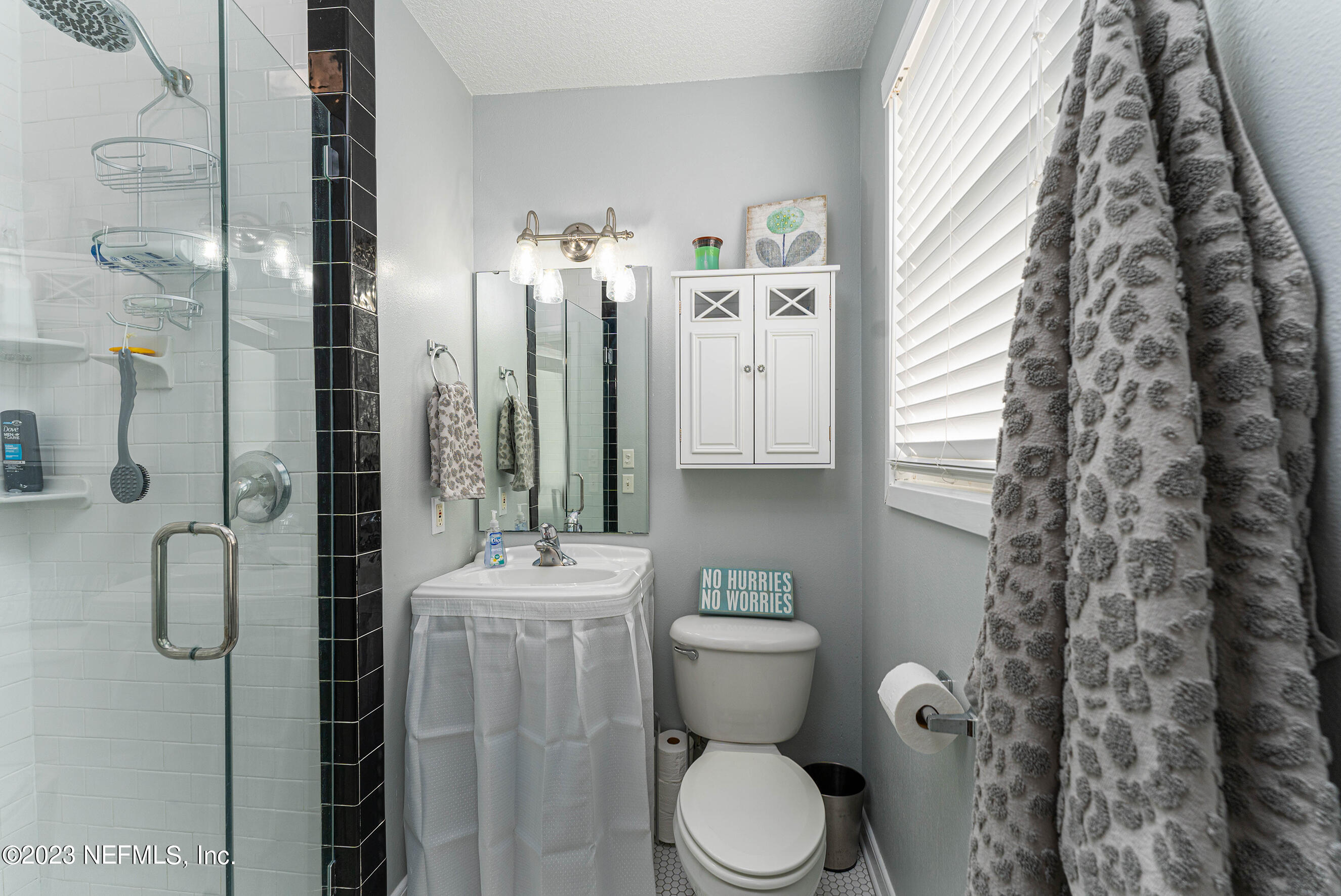 1544 Lorimier Road Jacksonville, FL 32207 - Photo 15 of 27 a bathroom with a toilet sink and shower