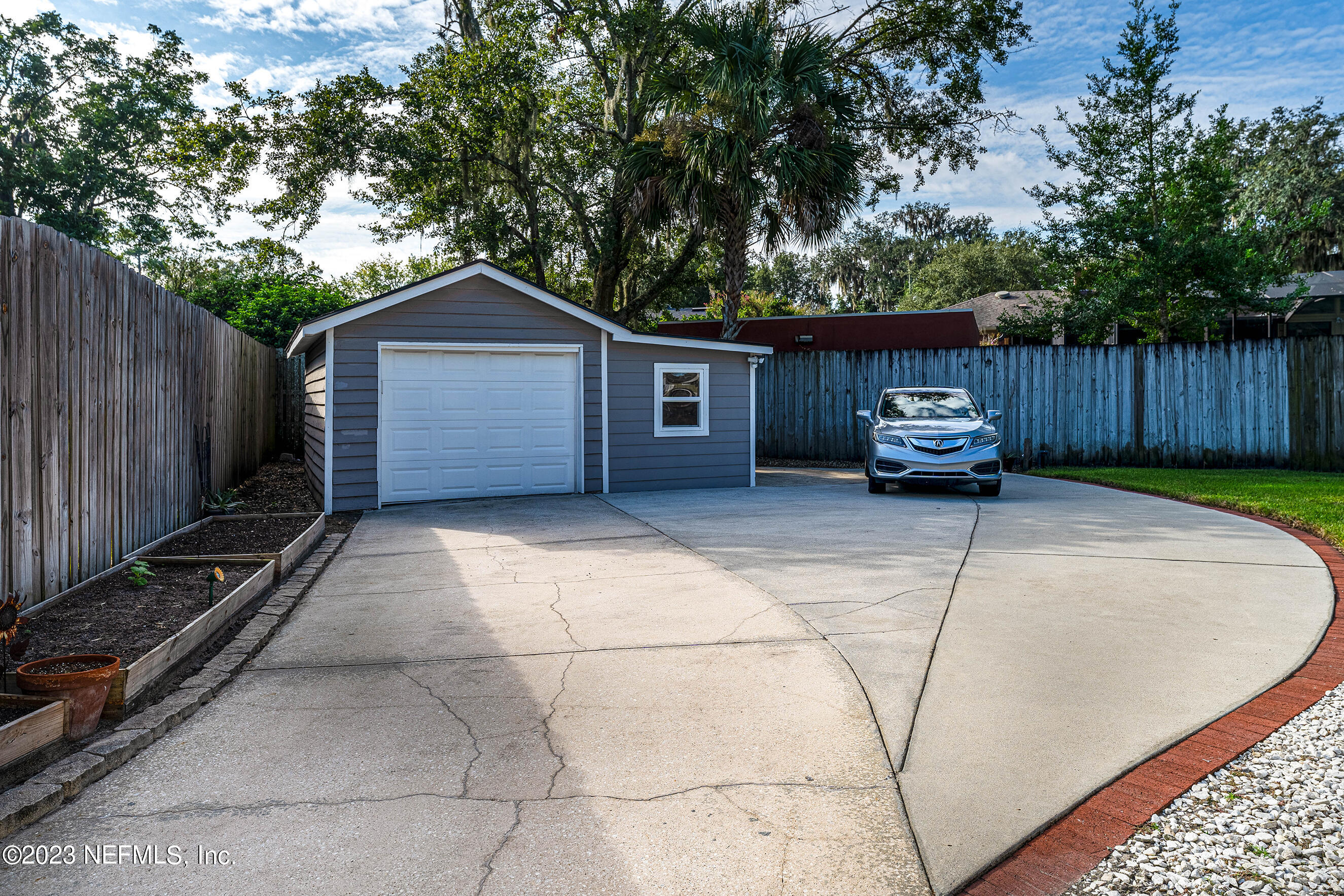 1544 Lorimier Road Jacksonville, FL 32207 - Photo 23 of 27 a house with trees in front of it