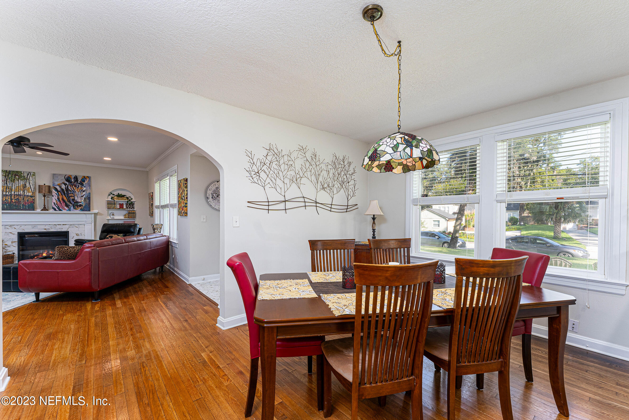1544 Lorimier Road Jacksonville, FL 32207 - Photo 8 of 27 a dining room with furniture a chandelier and a rug