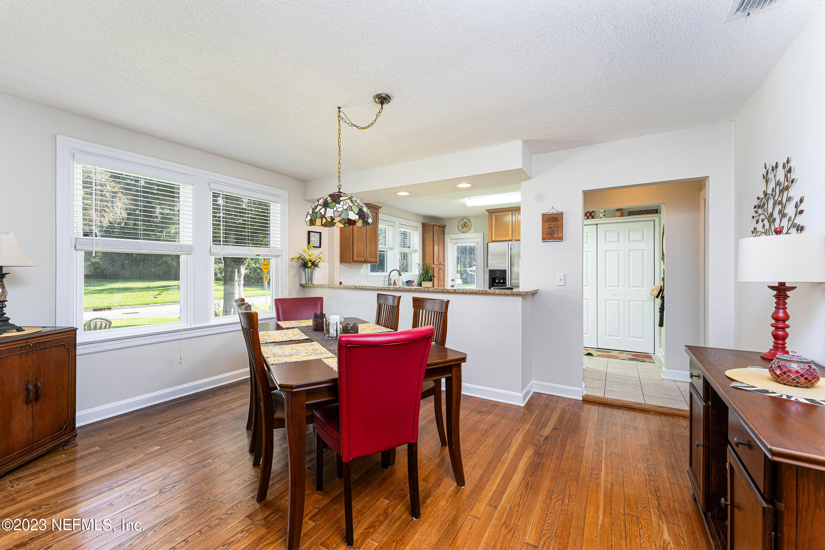 1544 Lorimier Road Jacksonville, FL 32207 - Photo 9 of 27 a view of a dining room with furniture window and wooden floor