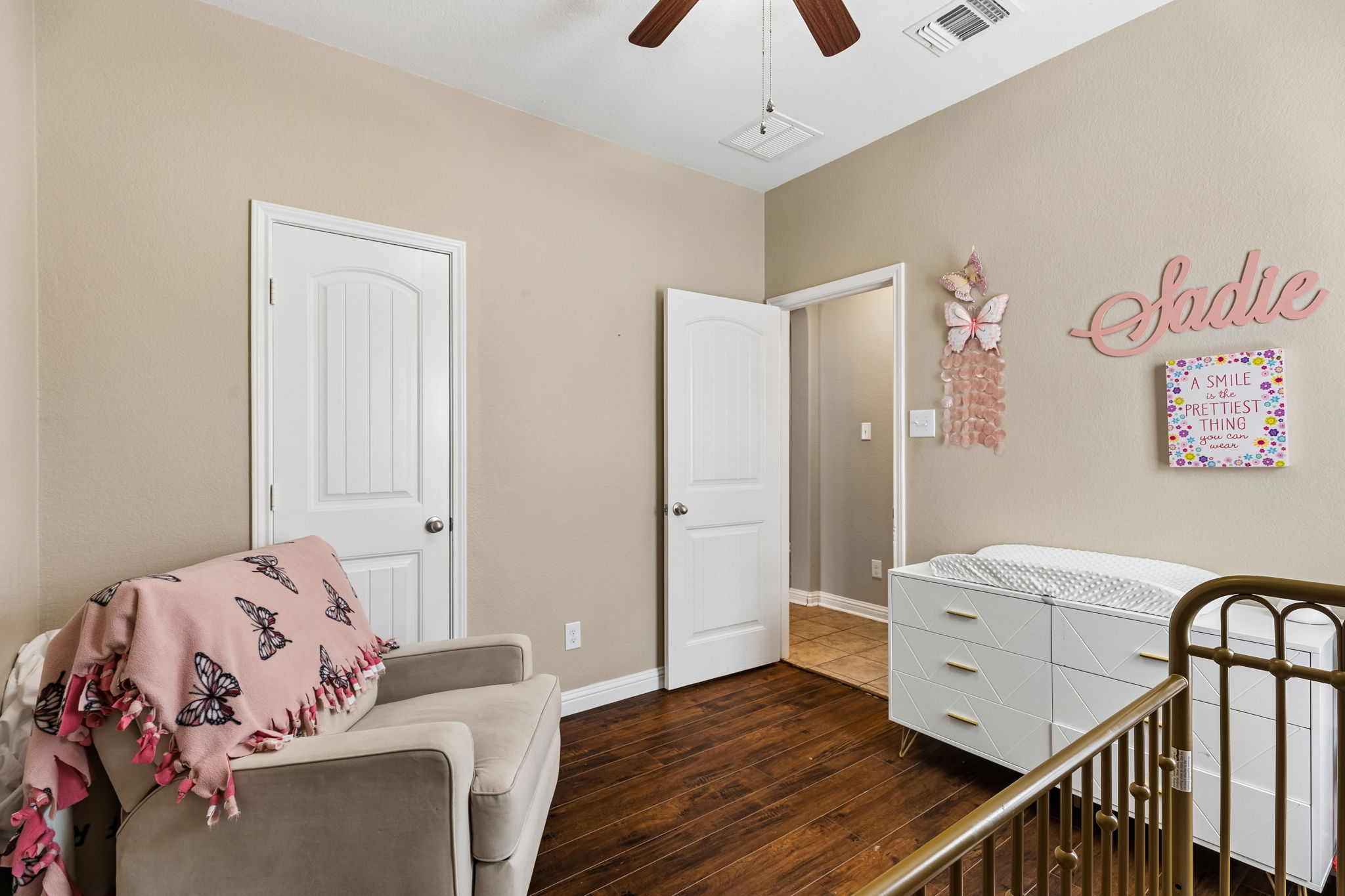 1113 Yellow Iris Road Leander, TX 78641 - Photo 18 of 26 Rich wood flooring pairs beautifully with neutral walls in this charming secondary room.