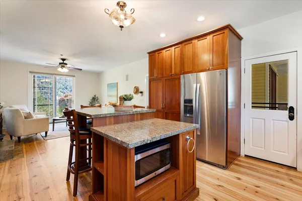 a kitchen with a sink and large window