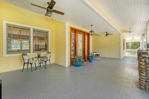 a view of a chairs and table in the patio
