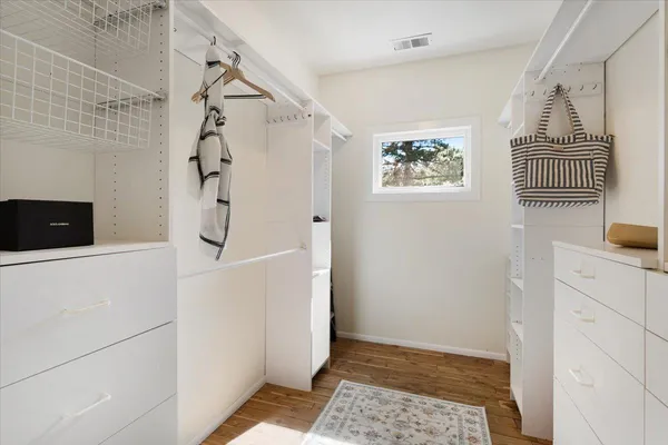 a spacious bedroom with two beds and a couch