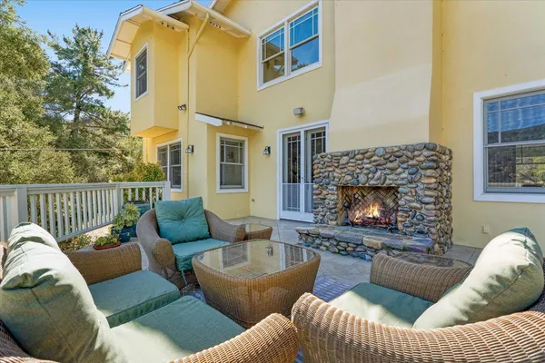 a view of a house with swimming pool and a yard